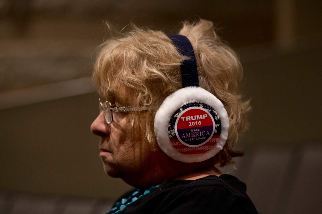 Marilyn Beske wears ear warmers with a campaign sticker for Republican presidential candidate Donald Trump on them at the Bridge View Center Saturday Jan. 9 2016 in Ottumwa Iowa