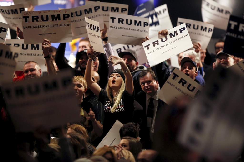 Supporters of U.S. Republican presidential candidate Donald Trump jeer at protesters during a campaign rally in Burlington Vt. on Jan. 7 2016