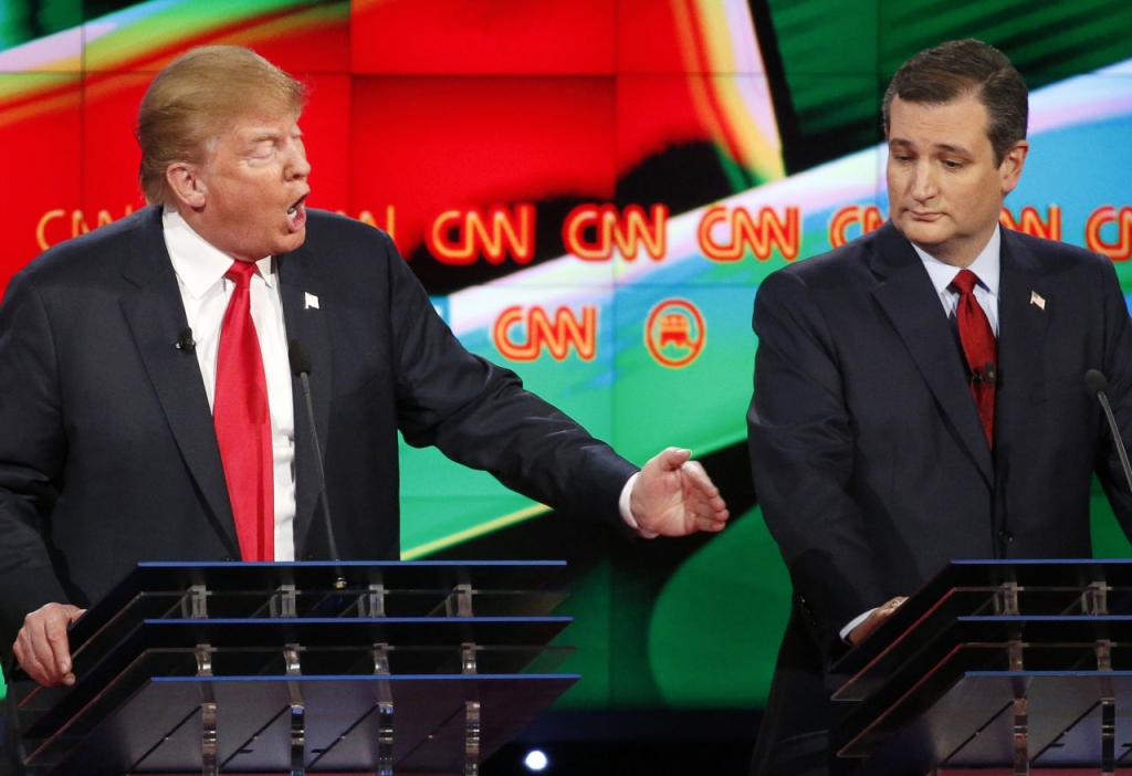 Donald Trump left responds forcefully to Jeb Bush as Ted Cruz looks on during the CNN Republican presidential debate at the Venetian Hotel & Casino on Tuesday Dec. 15 2015 in Las Vegas