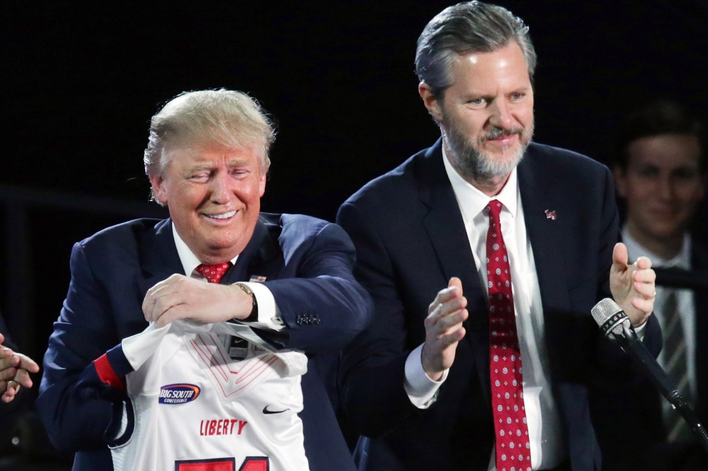 Jerry Falwell Jr. presents Republican presidential candidate Donald Trump with a sports jersey after he delivered the convocation on Jan. 18 2016 in Lynchburg Va