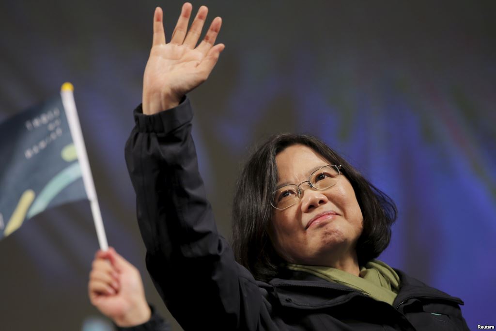 Democratic Progressive Party Chairperson and presidential candidate Tsai Ing-wen waves to supporters as they celebrate her election victory at the party's headquarters in Taipei Taiwan Jan. 16 2016