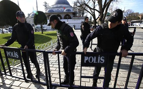 Policemen install security barriers at the historic Sultanahmet district which is popular with tourists after an explosion in Istanbul Tuesday Jan. 12 2016