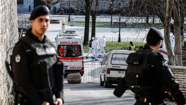 Turkish police stand guard next to ambulances as they block access to the Blue Mosque area after a blast in Istanbul. AFP