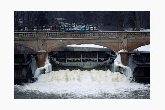 River near downtown Flint Mich. City leaders are floating a shockingly high price to replace the city's water infrastructure damaged after the state’s disastrous decision in 2014 to use the Flint Riv