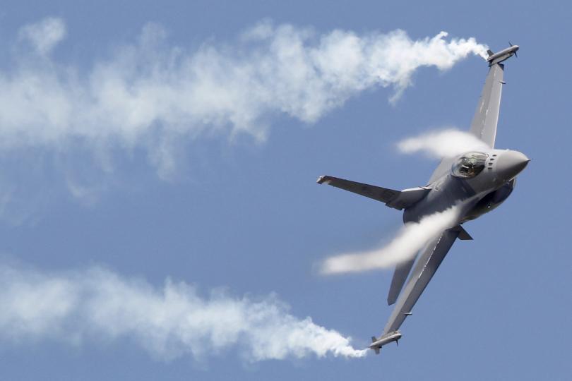 An F-16 maneuvers during an air show in Paris France