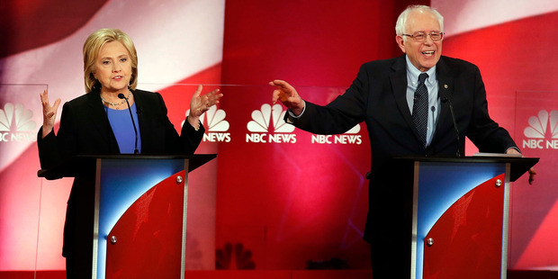 Democratic presidential candidates Hillary Clinton and Sen. Bernie Sanders interrupt each other during the NBC You Tube Democratic presidential debate