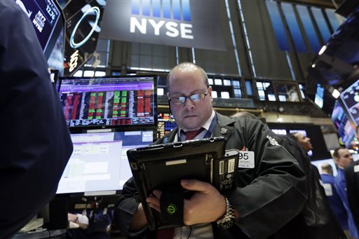 Trader Jeffrey Vazquez works on the floor of the New York Stock Exchange Thursday Jan. 7 2016. U.S. stocks are opening sharply lower as worries intensify about China's economy and dropping oil prices