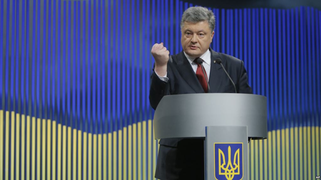 Ukrainian President Petro Poroshenko gestures while speaking during a news conference in Kyiv Ukraine Jan. 14 2016