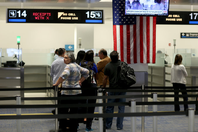 International travelers waiting to speak with a Customs and Border Patrol officer after arriving at Miami International Airport in March. About 38 countries participate in the United States visa-waiver program which allows their citizens to enter without