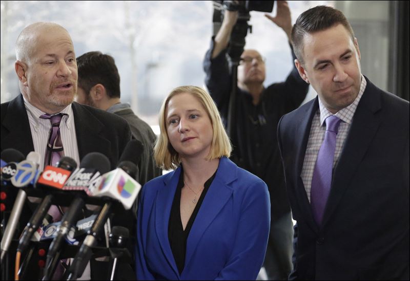 Mark Smolens left Nicole Barkowski and Brian Coffman right attorneys for the family of Cedrick Chatman who was shot and killed by Chicago police in 2013 speak at a news conference at the federal courthouse today