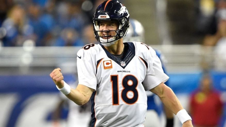 DETROIT MI- SEPTEMBER 27 Denver Broncos quarterback Peyton Manning #18 celebrates his pass to wide receiver Demaryius Thomas #88 that he will turn into a touchdown at the end of the first half vs the Detroit Lions at Ford Field in Detroit Mi Septembe