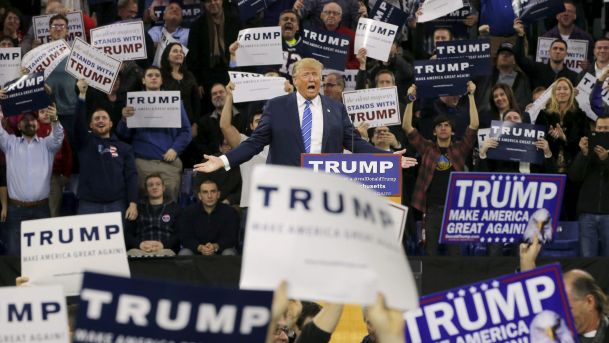 Audience members react as U.S. Republican presidential candidate Donald Trump speaks at a campaign rally in Lowell Massachusetts