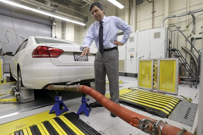 John Swanton spokesman with the California Air Resources Board explains how a 2013 Volkswagen Passat with a diesel engine is evaluated at the emissions test lab in El Monte Calif. California air quality regula