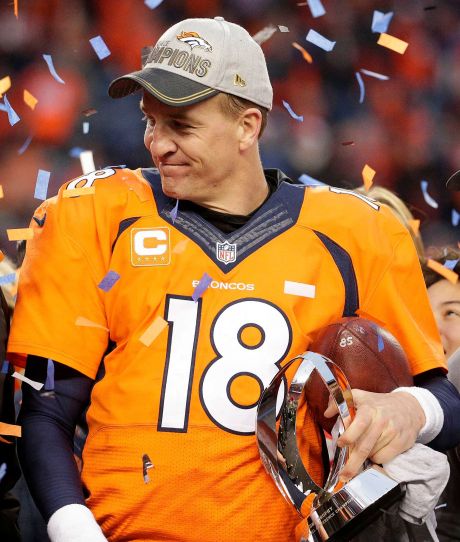 Denver Broncos quarterback Peyton Manning holds the AFC Championship trophy following the NFL football AFC Championship game between the Denver Broncos and the New England Patriots Sunday Jan. 24 2016 in Denver. The Broncos defeated the Patriots 20-18