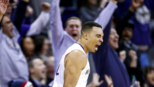 Washington guard Andrew Andrews reacts after making a three-point shot against UCLA during the second half Friday night