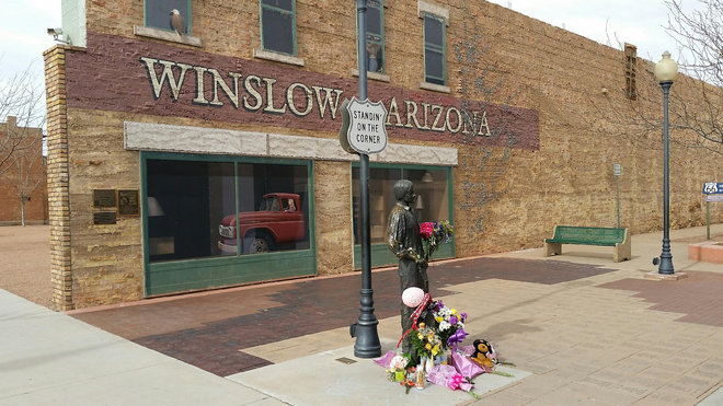 McCauley the corner in Winslow Ariz. made famous by the 1972 Eagles song'Take it Easy. Fans are leaving flowers hand-written notes and candles at the site to celebrate the life of Eagles band