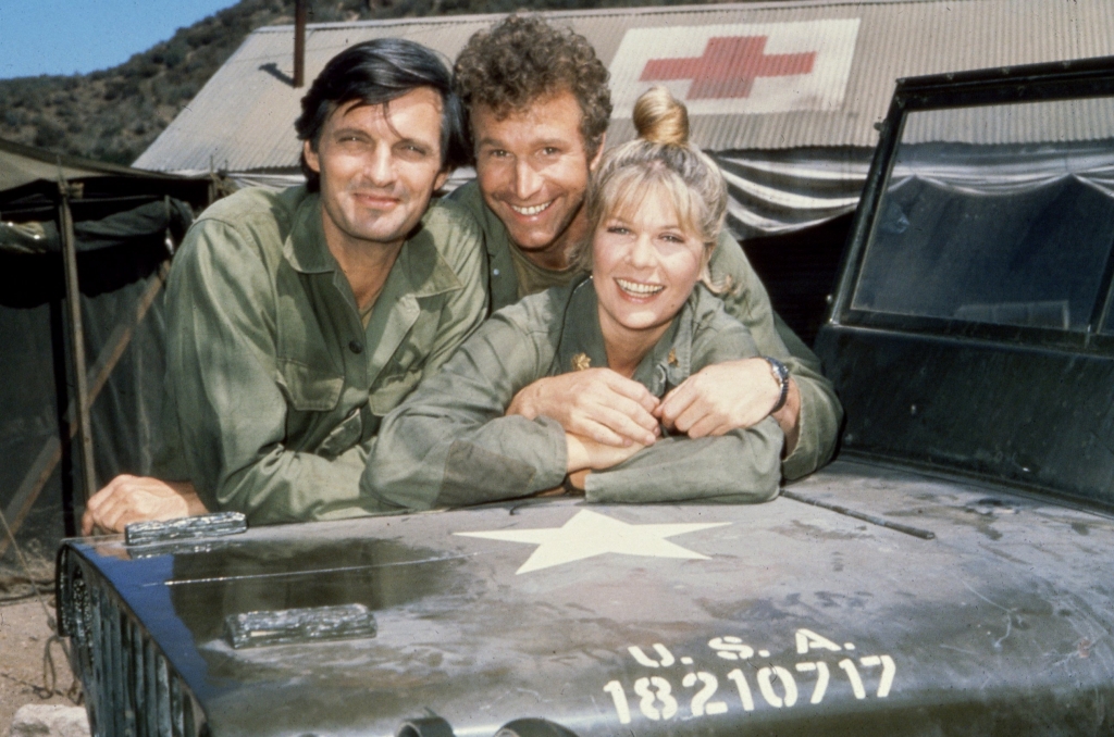 Wayne Rogers center is seen with his'M*A*S*H co-stars Alan Alda right and Loretta Swit