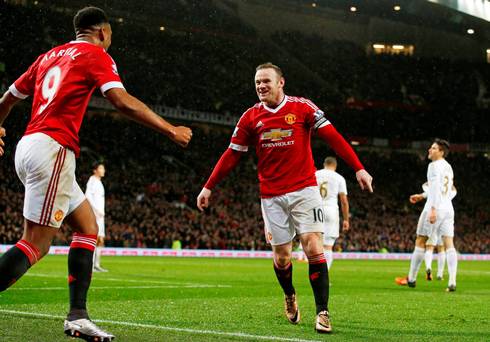 Wayne Rooney celebrates with Anthony Martial after scoring the second goal for Manchester United