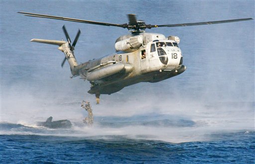 U.S. Marines and their Philippine counterparts jump from a US Marines CH-53D Sea Stallion helicopter at Ternate in Cavite province south of Manila. The U.S. Coast Guard says two Marine helicopters have collided off