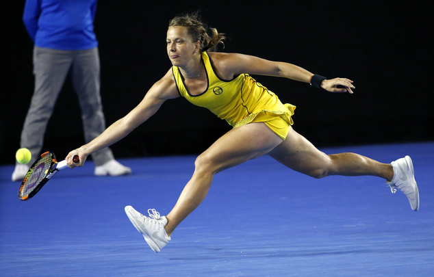 Barbora Strycova of the Czech Republic hits a forehand return to Garbine Muguruza of Spain during their third round match at the Australian Open tennis champ