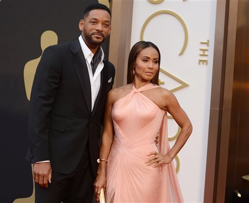 Will Smith left and Jada Pinkett Smith arrive at the Oscars at the Dolby Theatre in Los Angeles. Smith said Thursday Jan. 21 2016 he will not attend the Academy Awards next month joining his wife Jada Pinke