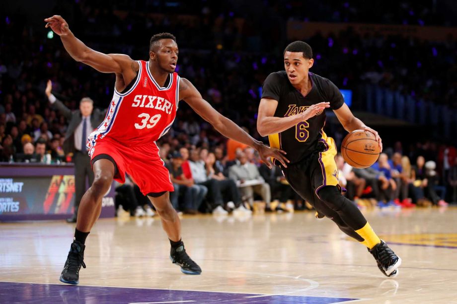 Philadelphia 76ers Jerami Grant left fouls Los Angeles Lakers Jordan Clarkson right during the first half of an NBA basketball game Friday Jan. 1 2016 in Los Angeles