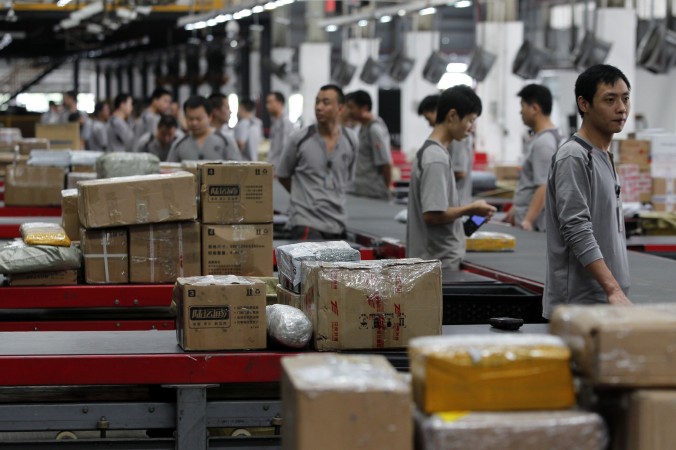 Workers distribute parcels at S.F. Express in Shenzhen China