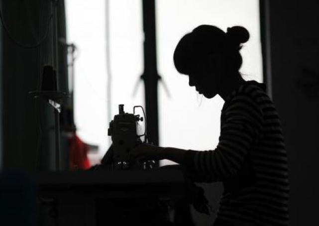 An employee works at a textile factory in Yiwu Zhejiang province