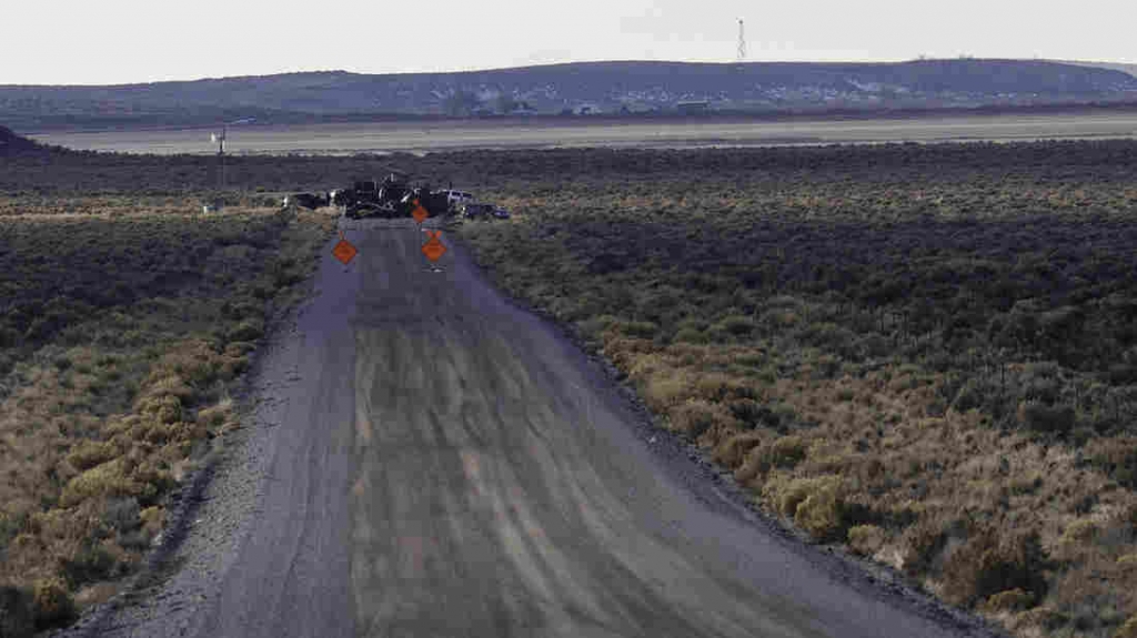 Police operate a checkpoint as part of a containment strategy around the Malheur Wildlife Refuge near Burns Ore. on Wednesday. Although leaders of the group that occupied the federal site were arrested armed militants remain at the refuge