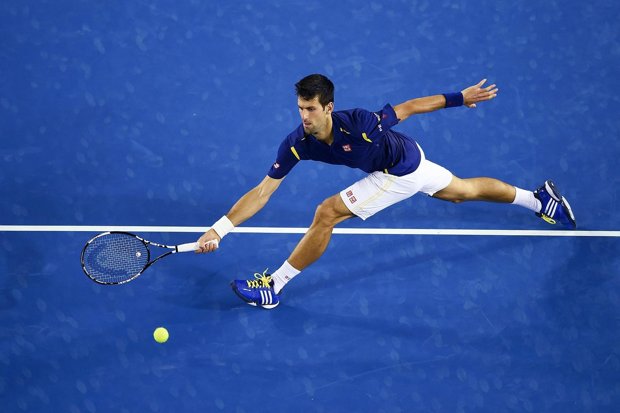 Novak Djokovic returns the ball to Quentin Halys of France during their second round match of the Australian Open
AAP