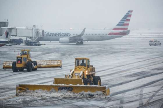 The tarmac of La Guardia Airport is cleared during a winter storm