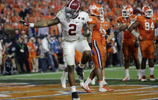 Alabama's Derrick Henry gives a Heisman pose after rushing for a touchdown during the second half of the NCAA college football playoff championship game against Clemson Monday Jan. 11 2016 in Glendale Ariz