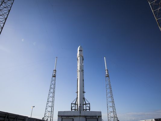 A Falcon 9 rocket sits on the pad with the SES-9 satellite