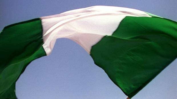 A Nigeria fan waves his countries flag