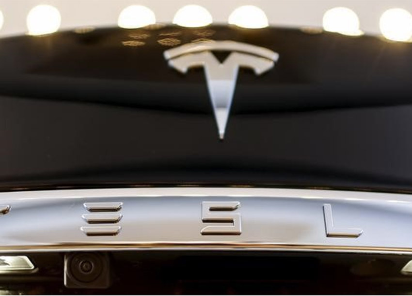 A Tesla logo adorns a'Model S car in the dealership in Berlin Germany