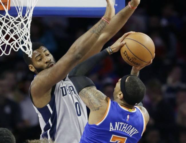 Knicks forward Carmelo Anthony shoots over the defense of Detroit Pistons center Andre Drummond during the first half Thursday