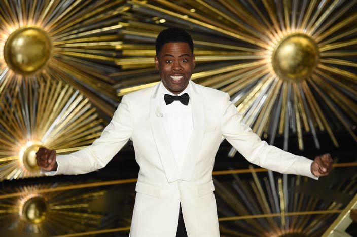 Actor Chris Rock presents on stage at the 88th Oscars