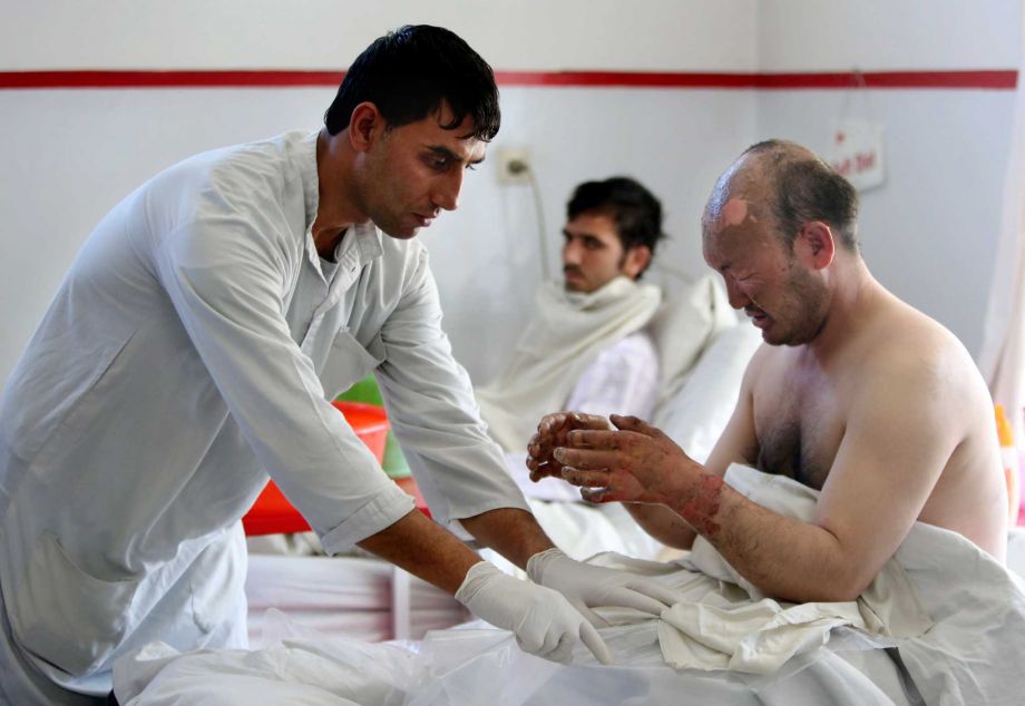 An injured victim from yesterday's suicide attack near the Russian Embassy receives treatment at a hospital in Kabul Afghanistan Thursday Jan. 21 2016. A deadly Taliban attack on a bus carrying employees of Afghanistan’s biggest TV station drew wid