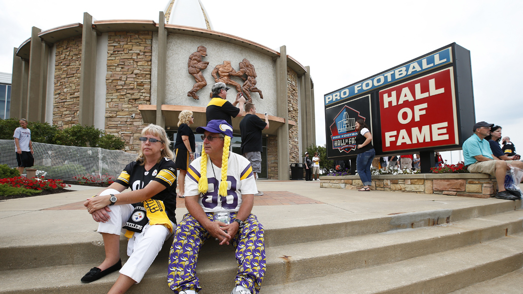 CANTON OH- AUGUST 9 Fans of the Pittsburgh Steelers and Minnesota Vikings sit on the front steps of the Pro Football Hall of Fame prior to the NFL Hall of Fame Game at Tom Benson Hall of Fame Stadium