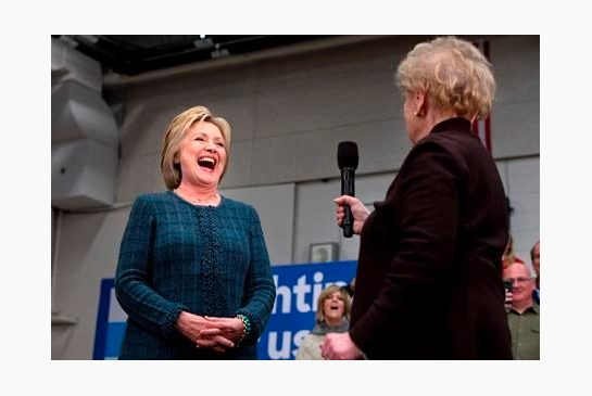 Democratic presidential candidate Hillary Clinton reacts as former Secretary of State Madeleine Albright says