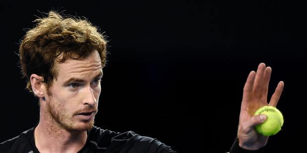 Andy Murray of Britain gestures before serving to Novak Djokovic of Serbia during the men's singles final at the Australian Open