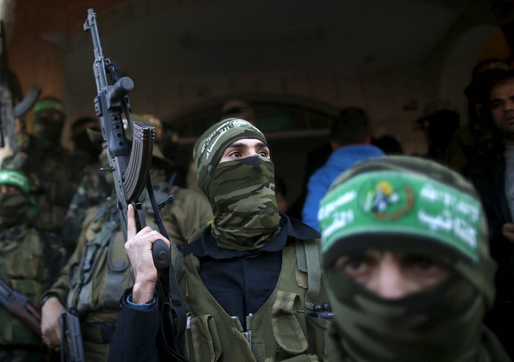 Palestinian Hamas militants take part in the funeral of their two comrades who were killed when a tunnel collapse on Tuesday in the village of Al Moghraga near central Gaza Strip