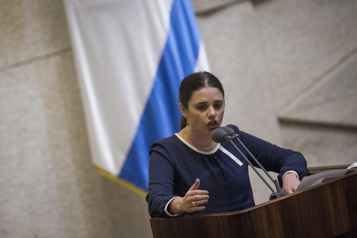 Justice Minister Ayelet Shaked speaks during a plenum session in the assembly hall of the Israeli parliament before the Knesset votes on the proposed law requiring Left-wing foundations and organizations to reveal their sources of funding on February 8