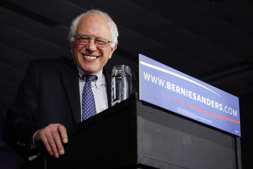 Democratic presidential candidate Sen. Bernie Sanders smiles as he speaks to supporters during a caucus night party Feb. 1 2016 in Des Moines Iowa