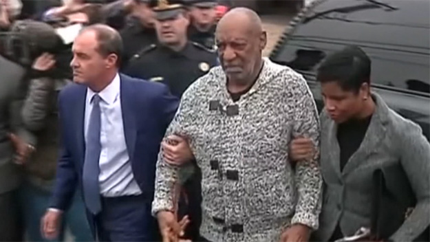 Bill Cosby is led into court in Elkins Park Pennsylvania on sexual assault charges