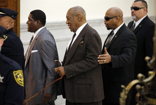 Bill Cosby center and his security team return to Courtroom A in a single file line after a lunch break on Wednesday Feb. 3 2016 at the Montgomery County Courthouse in Norristown Pa. The prosecutor in the sexual assault case against Cosby argued Wed