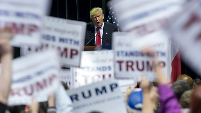 Trump at rally with signs