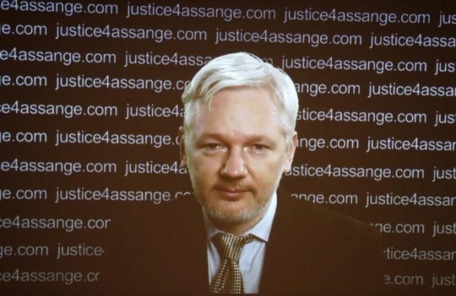 WikiLeaks founder Julian Assange appears on screen via video link during a news conference at the Frontline Club in London Britain