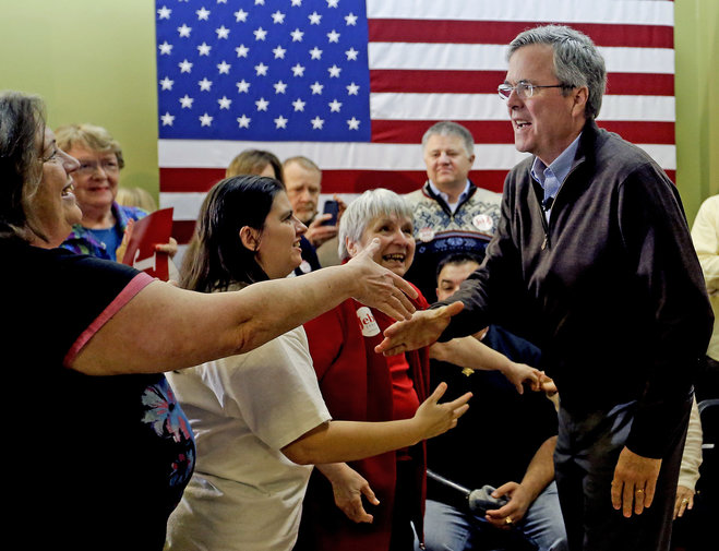 Republican presidential candidate Jeb Bush greets the crowd after a campaign event at the Jeb 2016 field office Sunday Jan. 31 2016 in Hiawatha Iowa