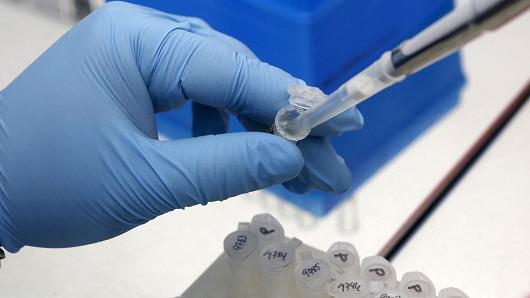 A medical researcher works on results of tests for preventing the spread of the Zika virus in Panama City Panama